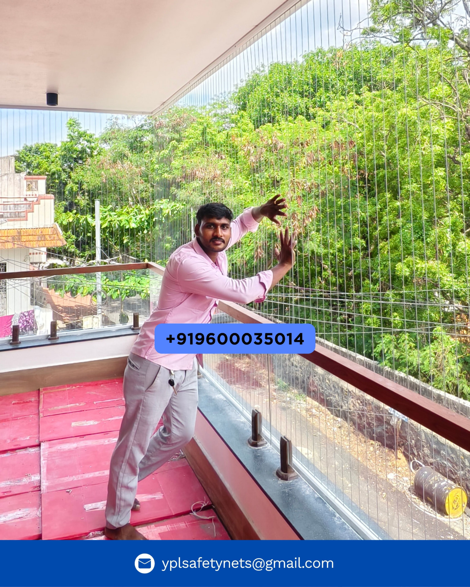 YPL installer fixing vertical stainless steel invisible grill cables on an open balcony with a leafy view, Chennai